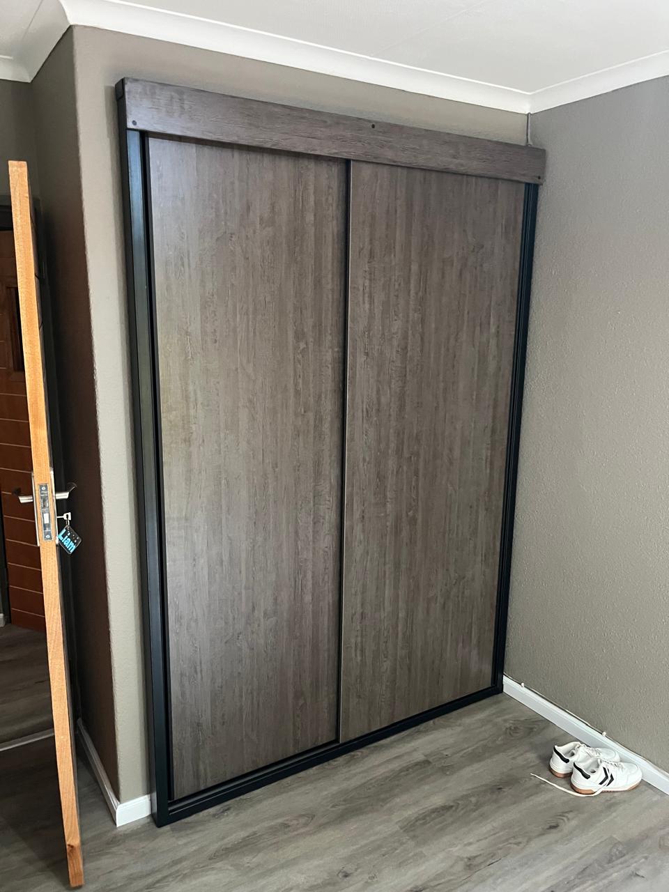 Built-in wardrobe sliding doors by WB Projects